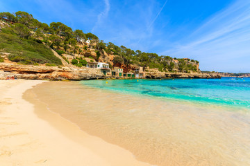 Fototapeta na wymiar Sandy beach in beautiful bay with azure sea water, Cala Llombards, Majorca island, Spain