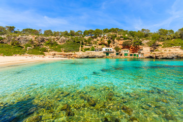 Fototapeta na wymiar A view of beach with azure sea water, Cala Llombards, Majorca island, Spain