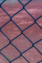 wire fence of the tennis courts