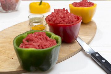 peppers stuffed with minced meat on white table