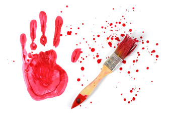 Paint brush and gouache red handprint on white canvas background in top view