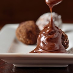 chocolate syrup flowing on candy homemade