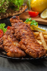 Fried fish in crispy batter with chips