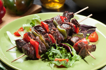 Grilled beef meat and vegetable kebabs