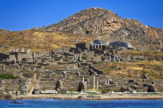 Greece. Cyclades Islands - Delos. Remains of ancient Sanctuary of Apollo, above Kynthos hill. The archaeological site of Delos is on UNESCO World Heritage List since 1990