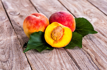 fresh peaches on wooden table