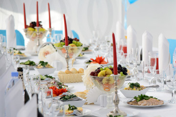 Festive table for  celebration. Banquet table with Cutlery and tableware. Table with white tablecloth served to guests. The table in the restaurant. Luxury Desk for the celebration.
