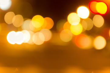 Blurry yellow evening lights as seen through abstract artistic point of view in traffic