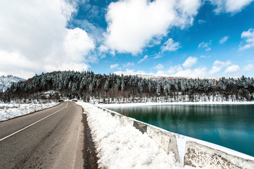 Landscape with winter road in Georgia. Shaori lake, Racha. Cauca