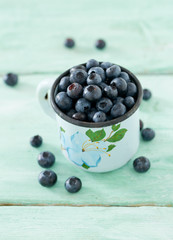 blueberry on wooden surface