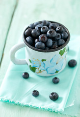blueberry on wooden surface