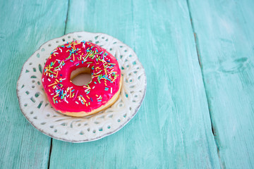 colorful doughnut on wooden surface