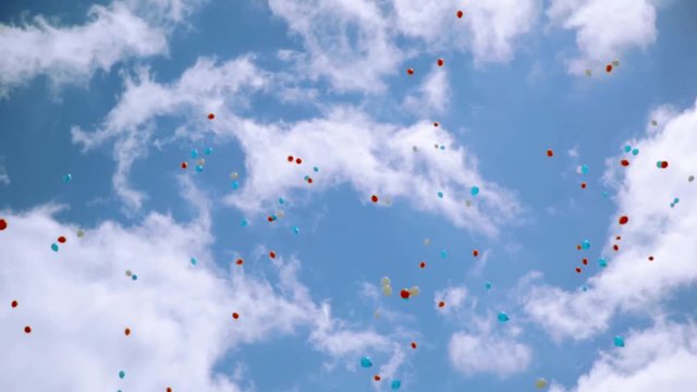 Many red, white, blue air balloons fly in beautiful cloudness sky. Colors of national Russian flag. Summer