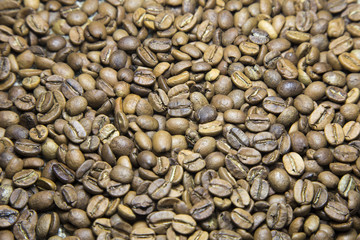 A coffee mug of coffee beans