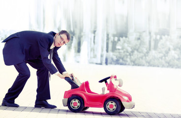 Businessman Pushing a Red Toy Car the Thing Next Business Move