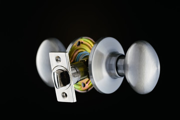Complete door knob mechanism isolated on black background