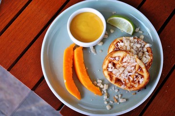 Tropical waffles with coconut and papaya