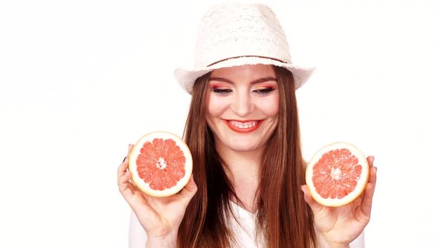 Woman joyful girl holds grapefruit citrus fruit in hands 4K