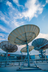 Silhouetted radio telescope dishes