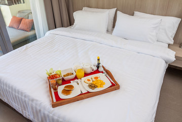 Breakfast in tray on bed
