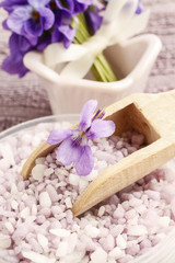 Obraz na płótnie Canvas Sea salt with viola flowers (viola odorata)