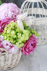 Floral arrangement with pink roses, peonies and matthiola flower