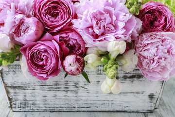 Floral arrangement with pink roses, peonies and matthiola flower