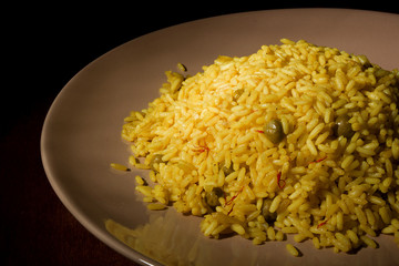 Risotto with Saffron on wooden table