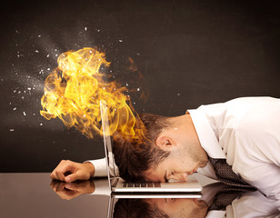 Stressed business man's head is burning