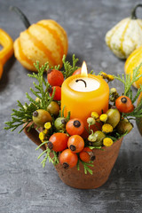 Fototapeta na wymiar Beautiful decoration with candle and autumn plants