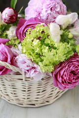Floral arrangement with pink roses, peonies and matthiola flower