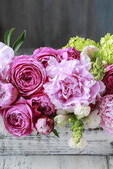 Floral arrangement with pink roses, peonies and matthiola flower