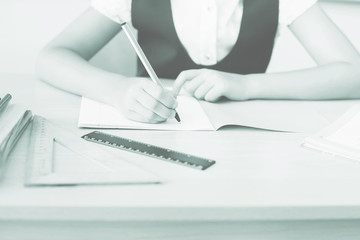 Desktop background of student sitting at desk for classwork