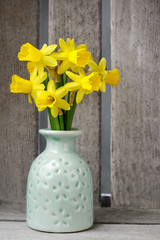 Bouquet of daffodils in ceramic vase