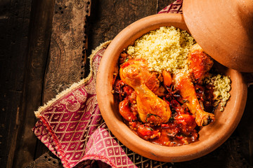 Traditional Tajine Dish with Chicken and Couscous - obrazy, fototapety, plakaty