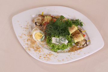eggplant rolls, served with egg and nut seasoning