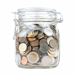 Money box coins stack thai baht isolated on a white background. Jar for savings full of coins. Piggy bank for saving money. Close up. Front view.