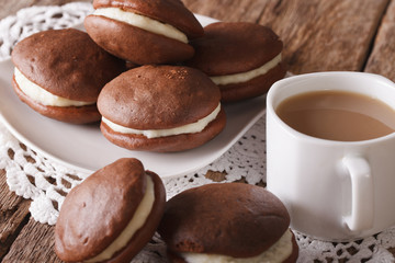 Chocolate Whoopie pie and coffee with milk close-up. horizontal
