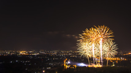 Beautiful firework display for celebration with city at night