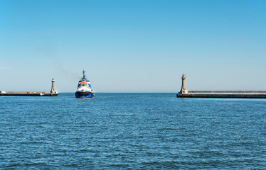A tugboat entering the harbor in Gdynia, Poland