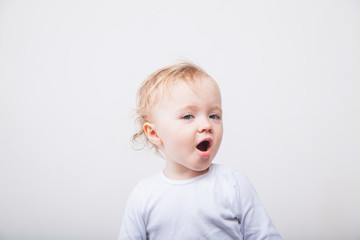 Little girl a on white background. Portrait