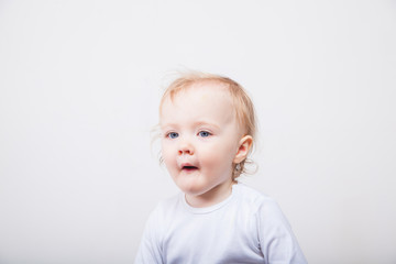 Naklejka premium Little girl a on white background. Portrait