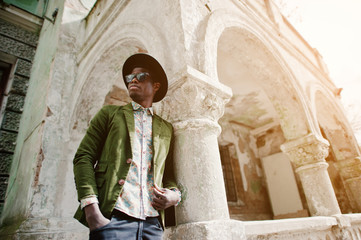 Fashion portrait of black african american man on green velvet j