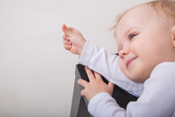 Cute baby girl lying on white background