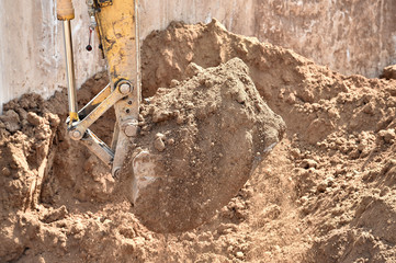  Working excavator that loads ground on construction site
