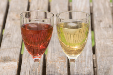 Red and white wine on a table.
