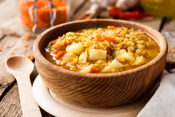 lentil soup in a wooden bowl