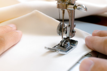 Sewing machine on fabric background