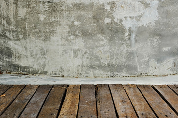 Vertical wooden planking floor and gray concrete wall. Display for objects. 