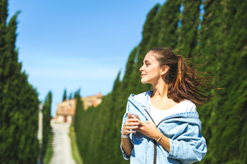  Young attractive woman making selfie on Tuscan road